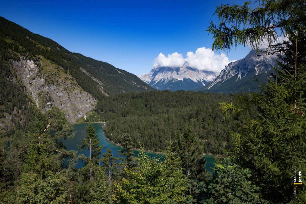 View from Austrian Fern Pass to deep blue lakes amidst mountains